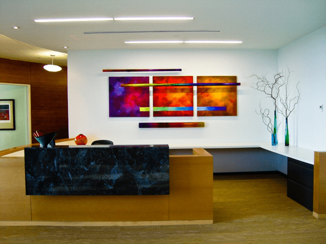 Modern office lobby with vibrant art, sleek furniture, and a minimalist vibe