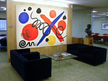 Abstract art with bold colors and shapes in an office, evoking modernism and creativity